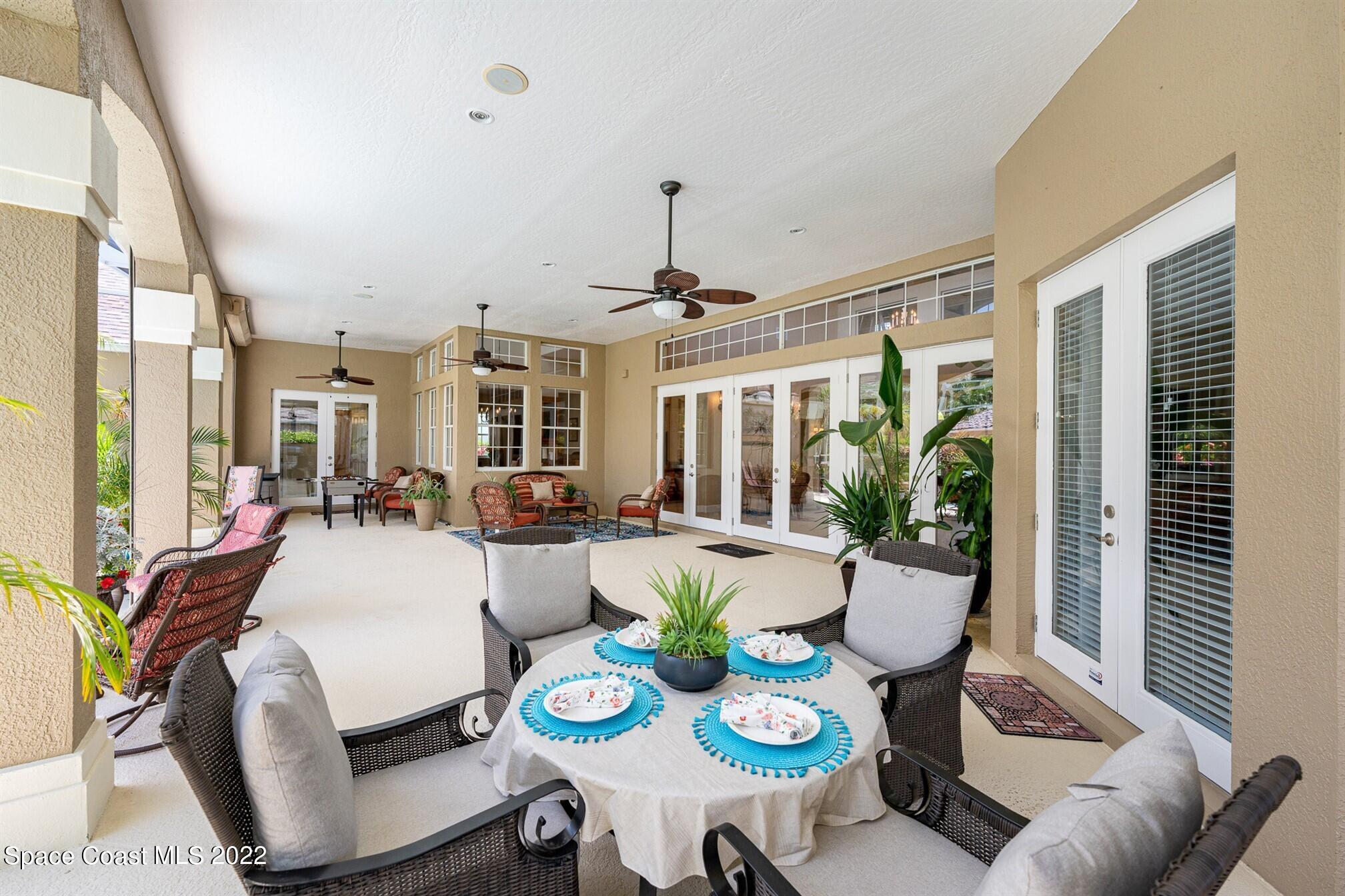 581 Nightingale Drive Indialantic, FL 32903 - Photo 44 of 67 a view of a dining room with furniture window and wooden floor