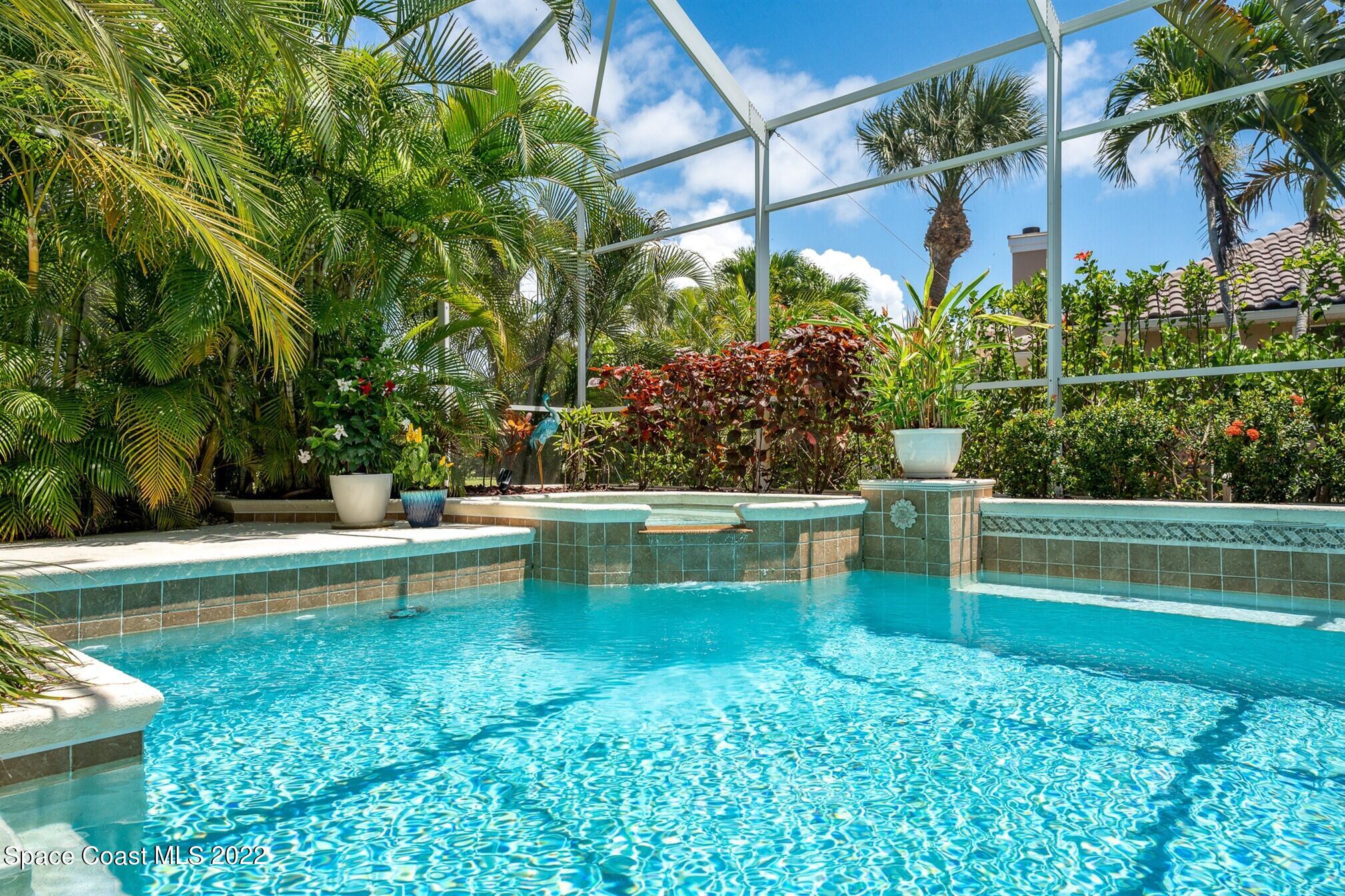 581 Nightingale Drive Indialantic, FL 32903 - Photo 46 of 67 a view of a swimming pool with a patio