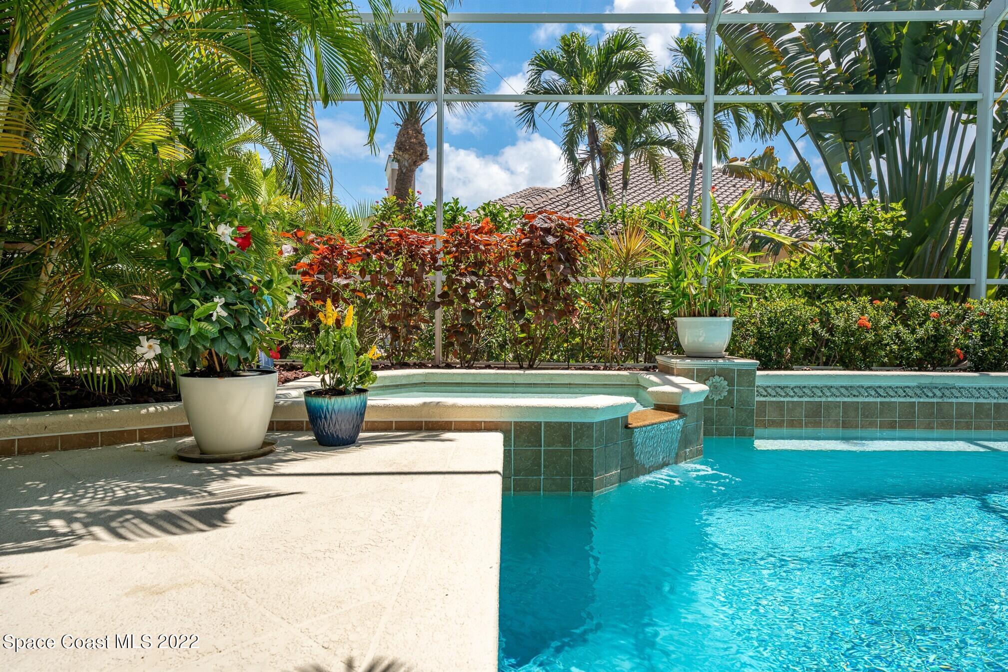 581 Nightingale Drive Indialantic, FL 32903 - Photo 50 of 67 a view of a swimming pool with a patio