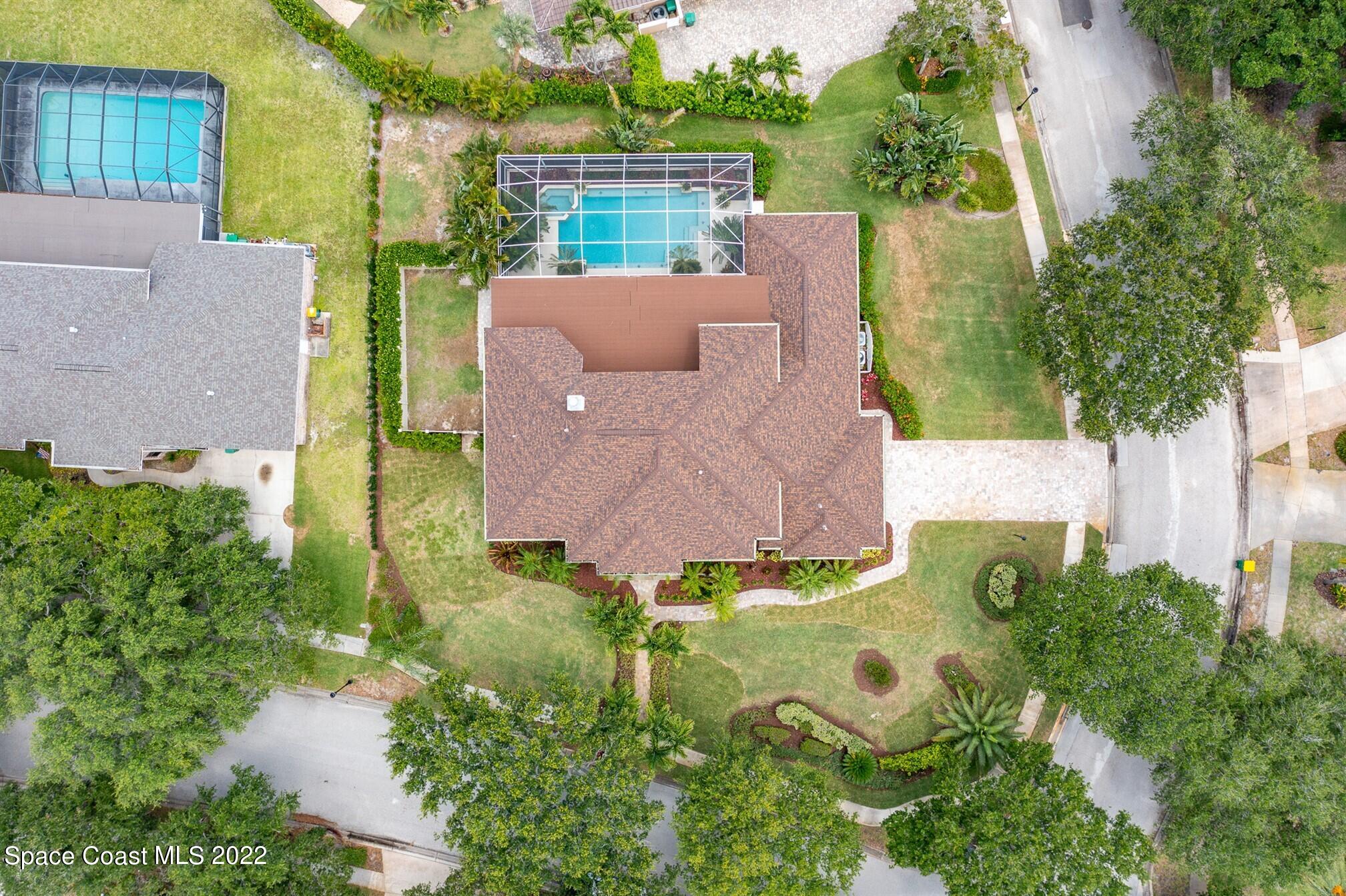 581 Nightingale Drive Indialantic, FL 32903 - Photo 56 of 67 an aerial view of a house with a garden