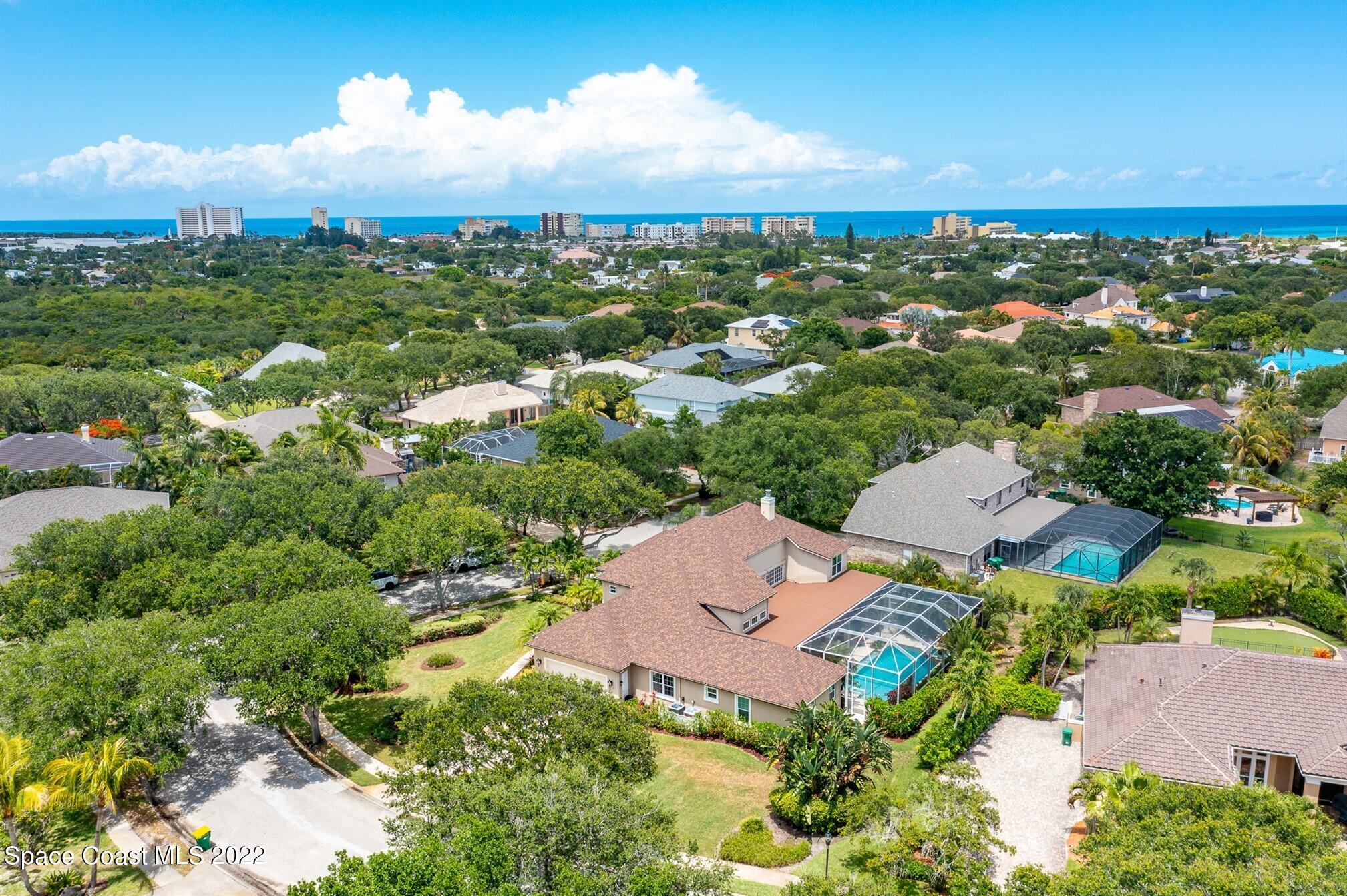 581 Nightingale Drive Indialantic, FL 32903 - Photo 57 of 67 an aerial view of a city with lots of residential buildings