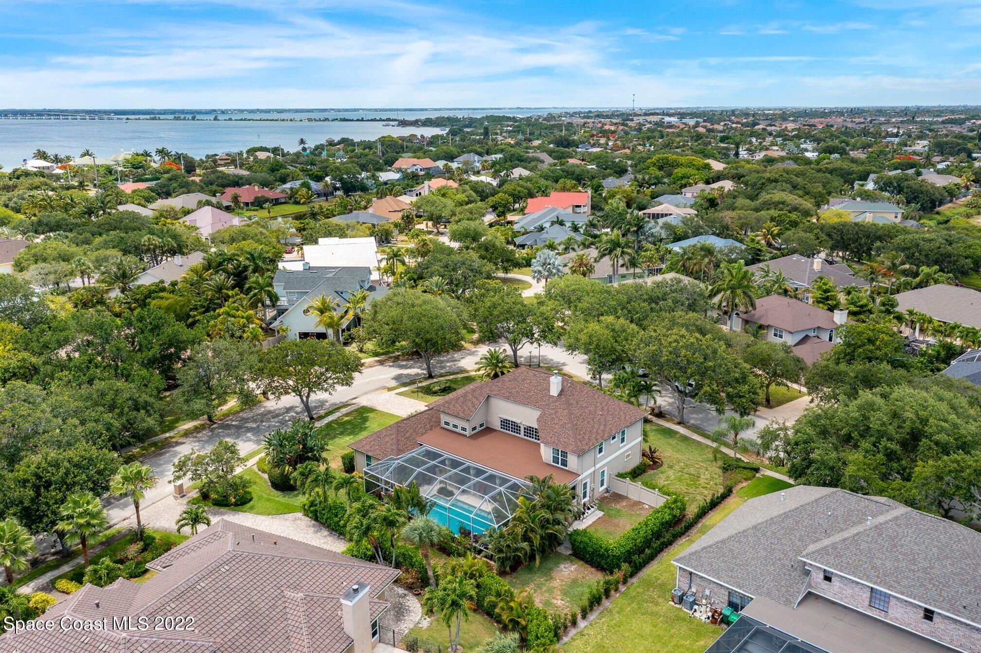 581 Nightingale Drive Indialantic, FL 32903 - Photo 58 of 67 an aerial view of a city with lots of residential buildings