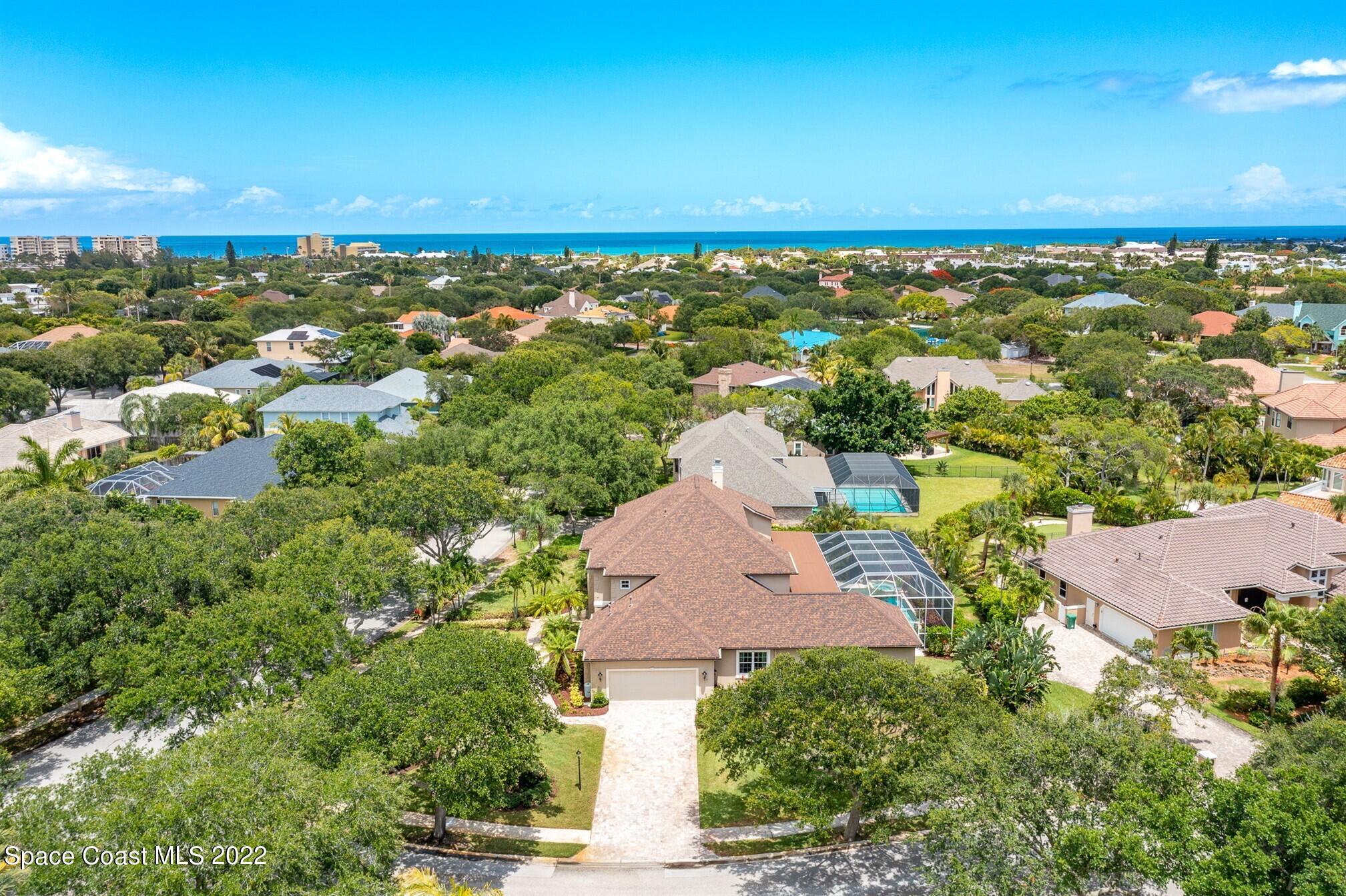 581 Nightingale Drive Indialantic, FL 32903 - Photo 60 of 67 an aerial view of a building and trees