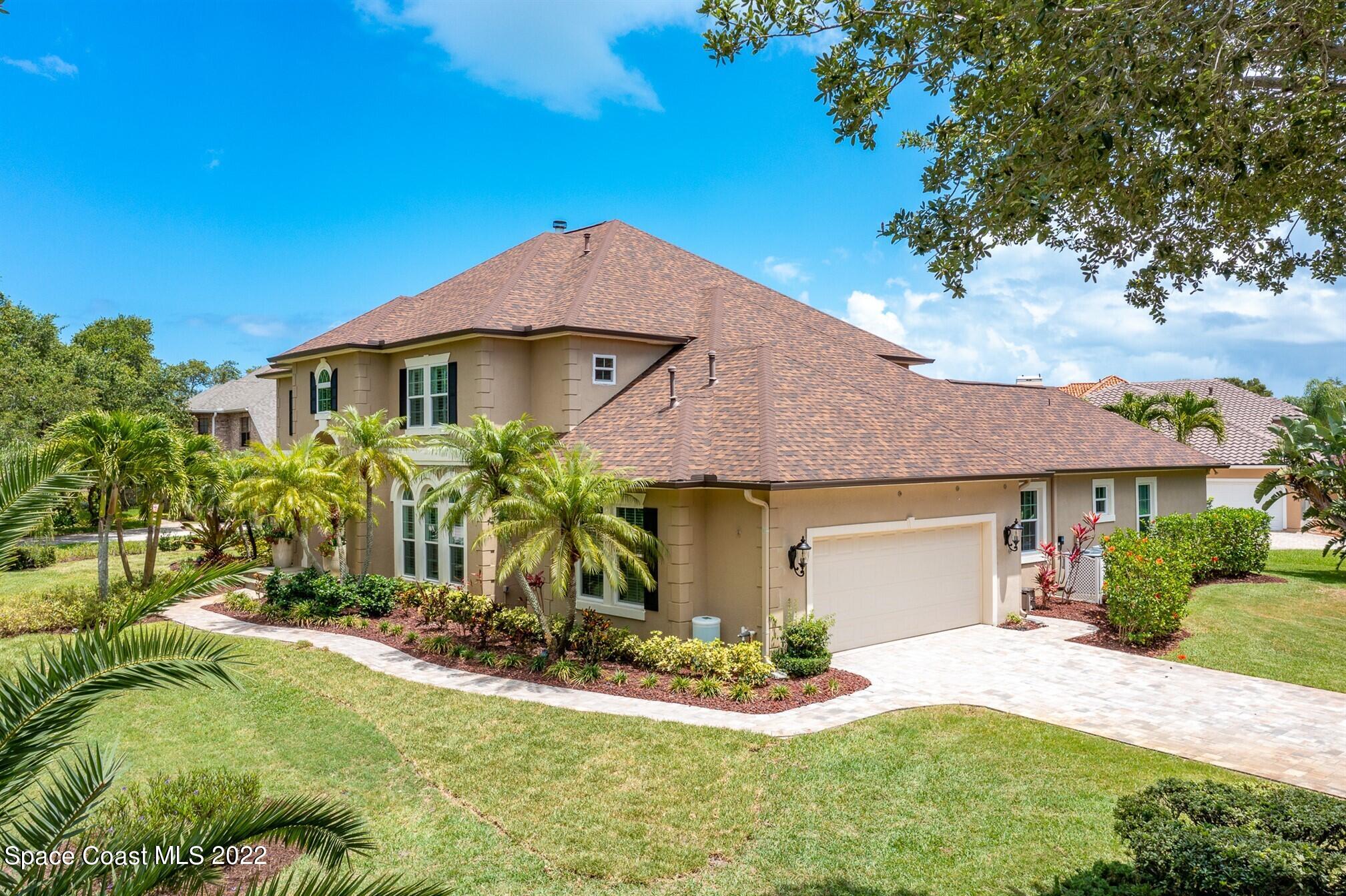 581 Nightingale Drive Indialantic, FL 32903 - Photo 62 of 67 a front view of a house with a yard