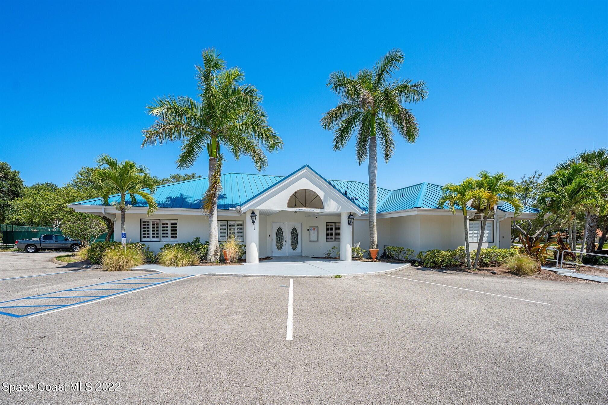 581 Nightingale Drive Indialantic, FL 32903 - Photo 67 of 67 a front view of a house with a garden and a garage