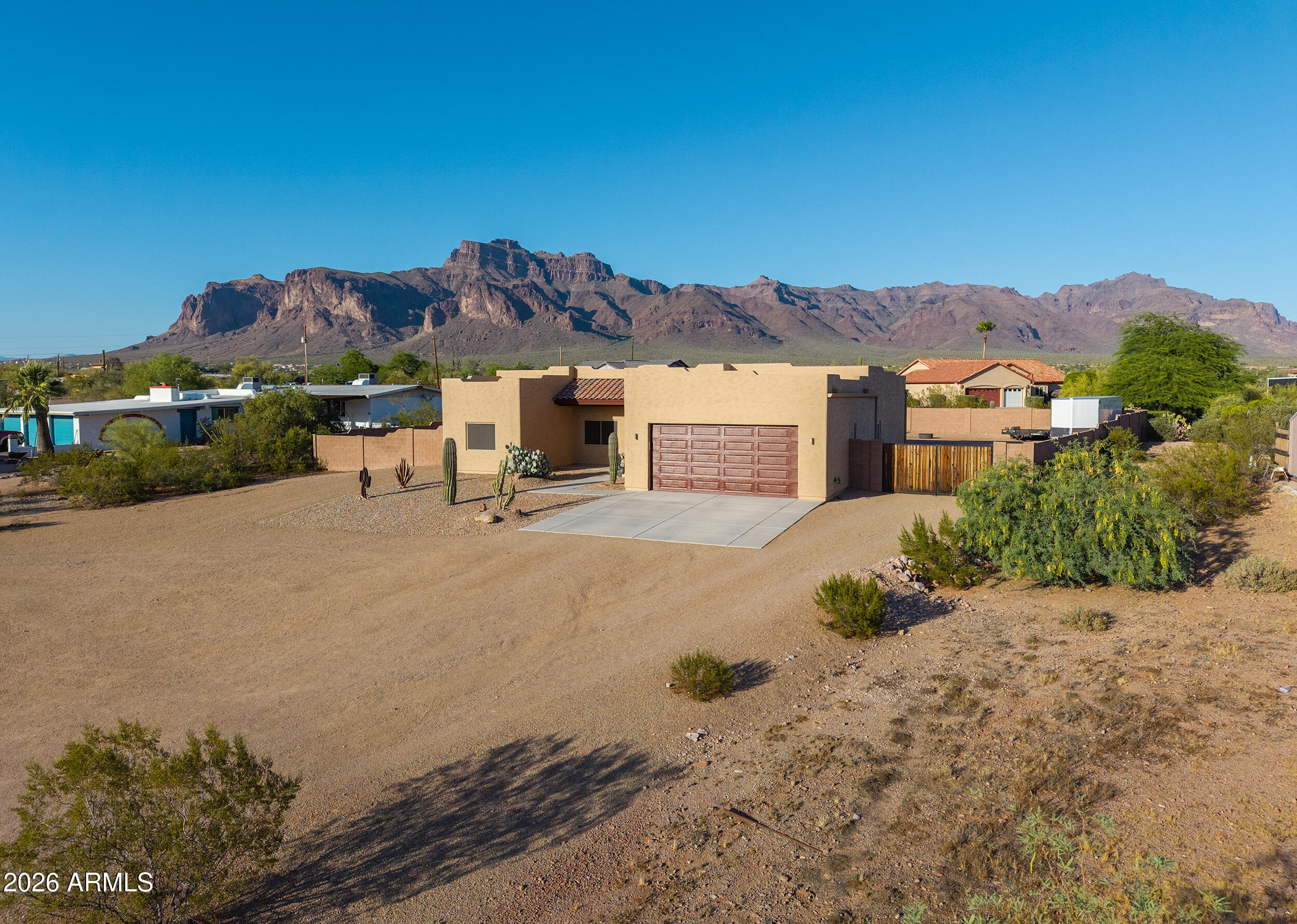 1487 South Mountain View Road Apache Junction, AZ 85119 - Photo 58 of 60 a view of a house with a yard and mountain view in front of it