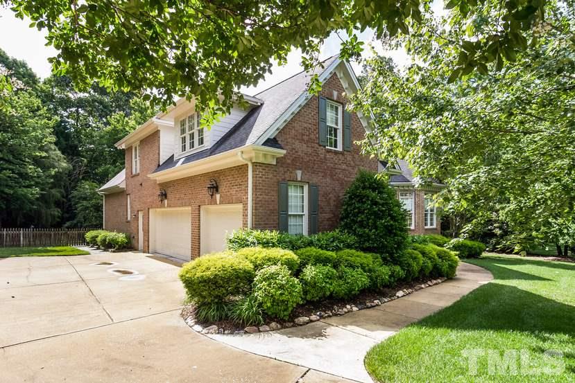 7212 Small Ridge Circle Raleigh, NC 27614 - Photo 2 of 24 a front view of a house with garden