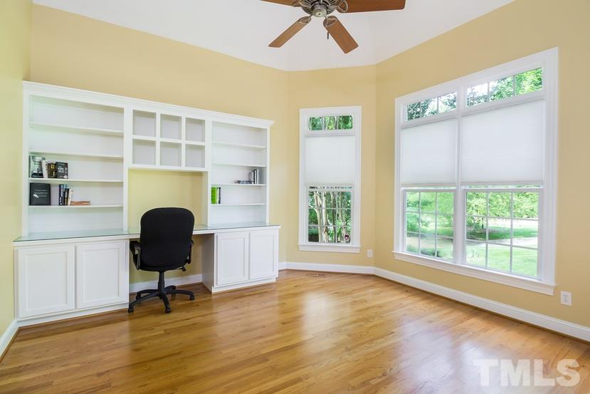 7212 Small Ridge Circle Raleigh, NC 27614 - Photo 12 of 24 a view of a workspace with furniture and a window