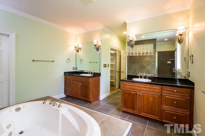 7212 Small Ridge Circle Raleigh, NC 27614 - Photo 15 of 24 a bathroom with a sink and a mirror