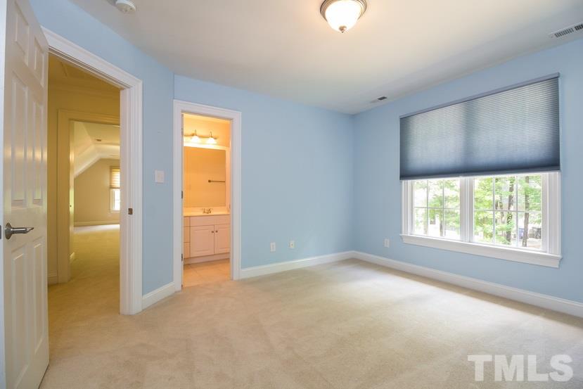 7212 Small Ridge Circle Raleigh, NC 27614 - Photo 18 of 24 a view of an empty room with a window