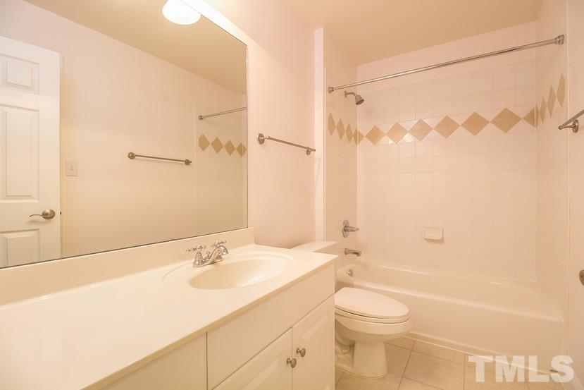 7212 Small Ridge Circle Raleigh, NC 27614 - Photo 19 of 24 a bathroom with a sink a toilet and shower