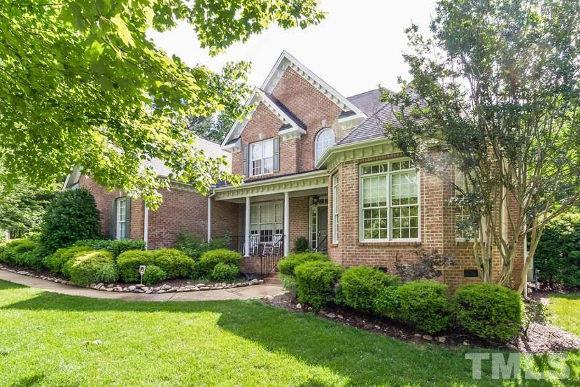 7212 Small Ridge Circle Raleigh, NC 27614 - Photo 3 of 24 a view of a house with a yard and plants