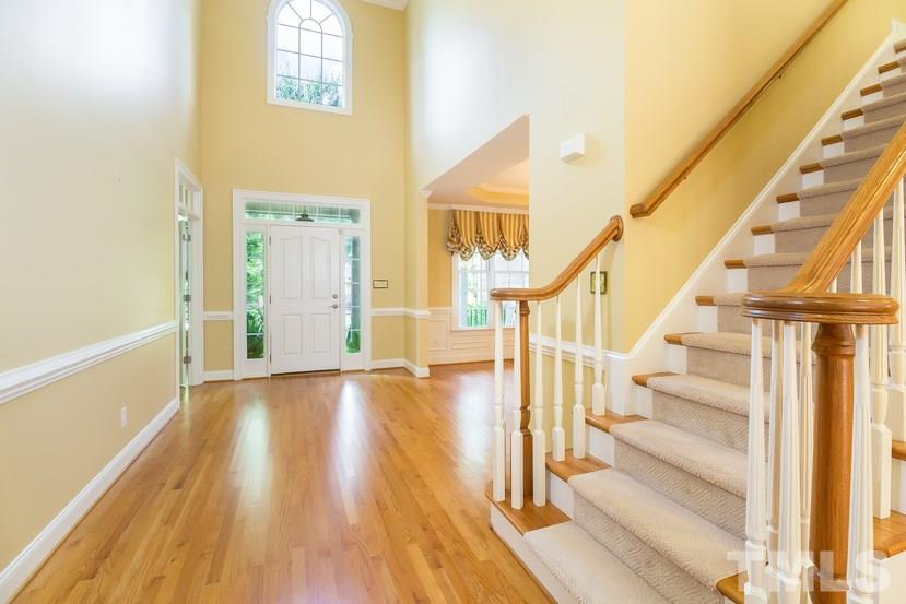 7212 Small Ridge Circle Raleigh, NC 27614 - Photo 7 of 24 a view of entryway with wooden floor and front door