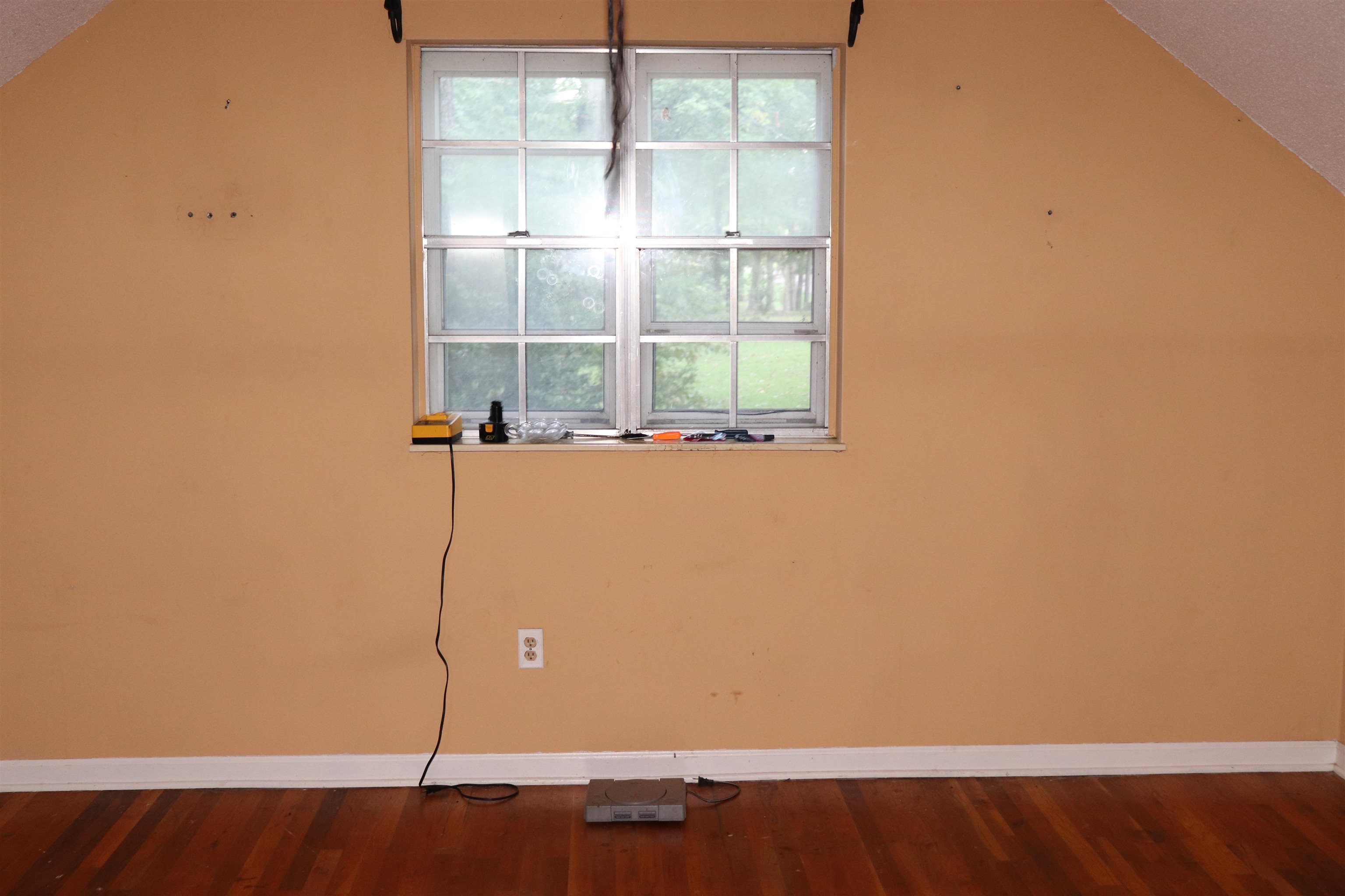 5952 Ivanhoe Road Bartlett, TN 38134 - Photo 11 of 23 a view of a small space with wooden floor and a window