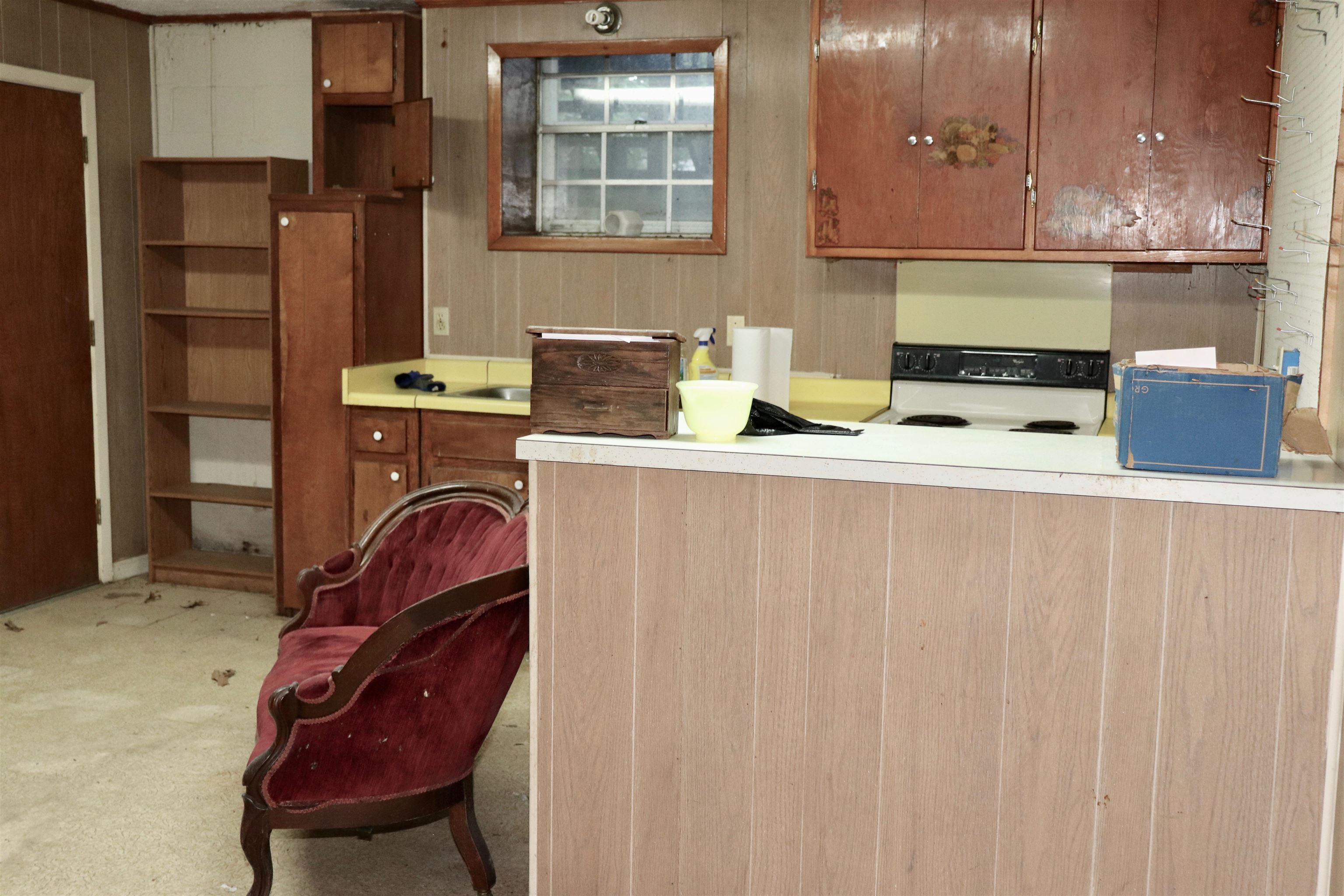 5952 Ivanhoe Road Bartlett, TN 38134 - Photo 12 of 23 a room with stainless steel appliances kitchen island granite countertop a refrigerator and a stove