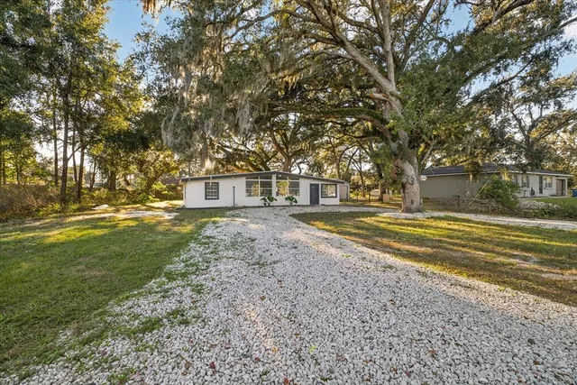 a house view with swimming pool