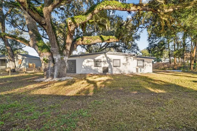 a view of a house with basketball yard