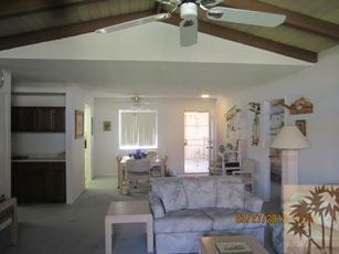 1050 Ramon Road, Unit 127 Palm Springs, CA 92264 - Photo 11 of 25 a living room with furniture and a fireplace