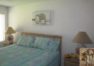 1050 Ramon Road, Unit 127 Palm Springs, CA 92264 - Photo 20 of 25 a bedroom with a bed and window