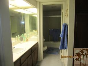 1050 Ramon Road, Unit 127 Palm Springs, CA 92264 - Photo 22 of 25 a bathroom with a sink and a mirror