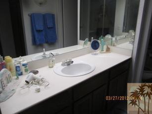 1050 Ramon Road, Unit 127 Palm Springs, CA 92264 - Photo 23 of 25 a bathroom with a sink and a mirror