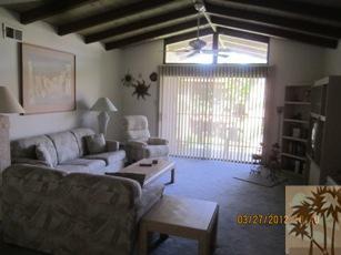 1050 Ramon Road, Unit 127 Palm Springs, CA 92264 - Photo 6 of 25 a living room with furniture and a flat screen tv