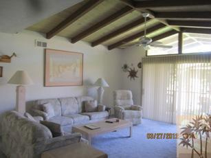 1050 Ramon Road, Unit 127 Palm Springs, CA 92264 - Photo 7 of 25 a living room with furniture and a window