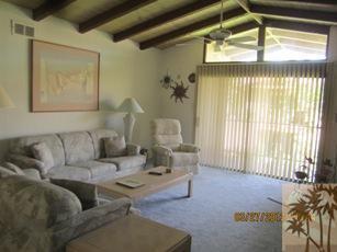 1050 Ramon Road, Unit 127 Palm Springs, CA 92264 - Photo 8 of 25 a living room with furniture and a window