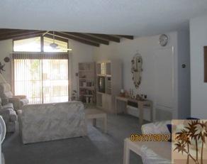 1050 Ramon Road, Unit 127 Palm Springs, CA 92264 - Photo 9 of 25 a living room with furniture and a large window