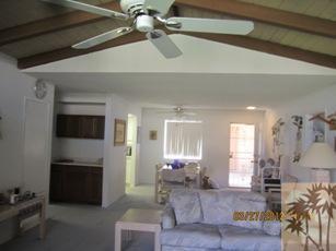 1050 Ramon Road, Unit 127 Palm Springs, CA 92264 - Photo 10 of 25 a living room with furniture and a flat screen tv