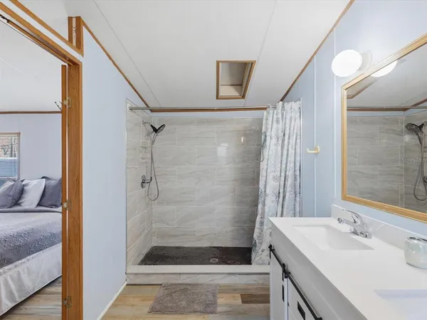a bathroom with a bathtub and shower