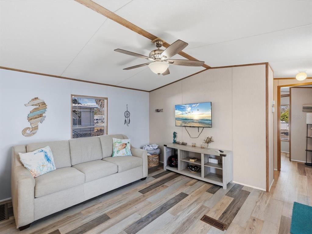 6419 West Richard Drive Weeki Wachee, FL 34607 - Photo 21 of 75 a living room with furniture and a flat screen tv