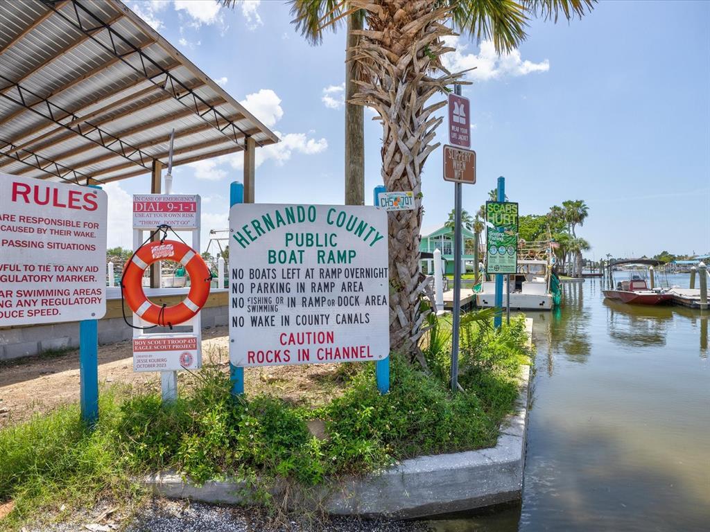 6419 West Richard Drive Weeki Wachee, FL 34607 - Photo 49 of 75 a sign on the side of a building