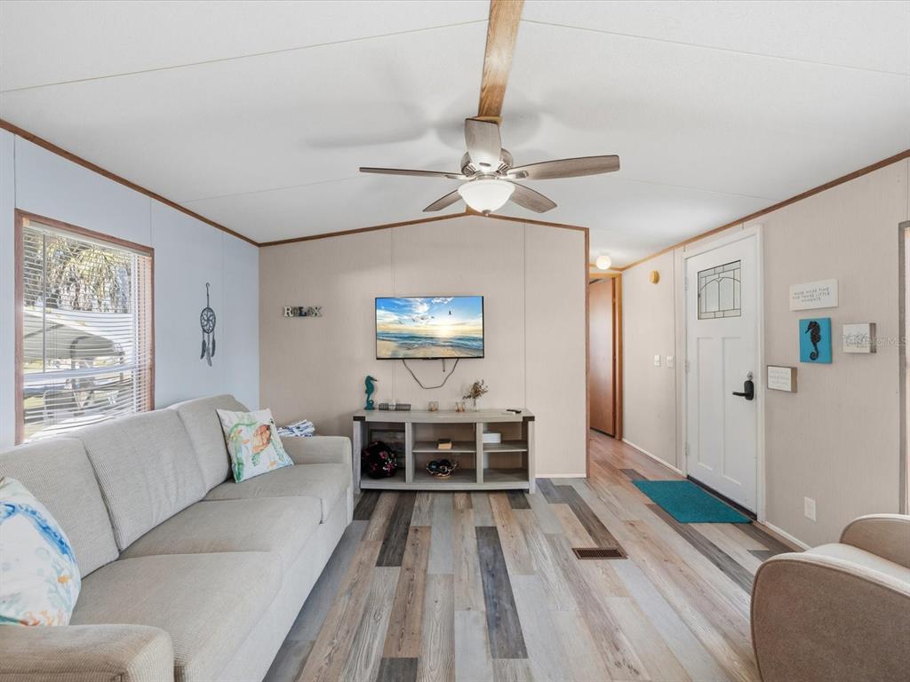 6419 West Richard Drive Weeki Wachee, FL 34607 - Photo 5 of 75 a living room with furniture and a chandelier