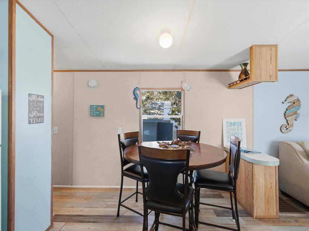 6419 West Richard Drive Weeki Wachee, FL 34607 - Photo 9 of 75 a dining room with furniture and window