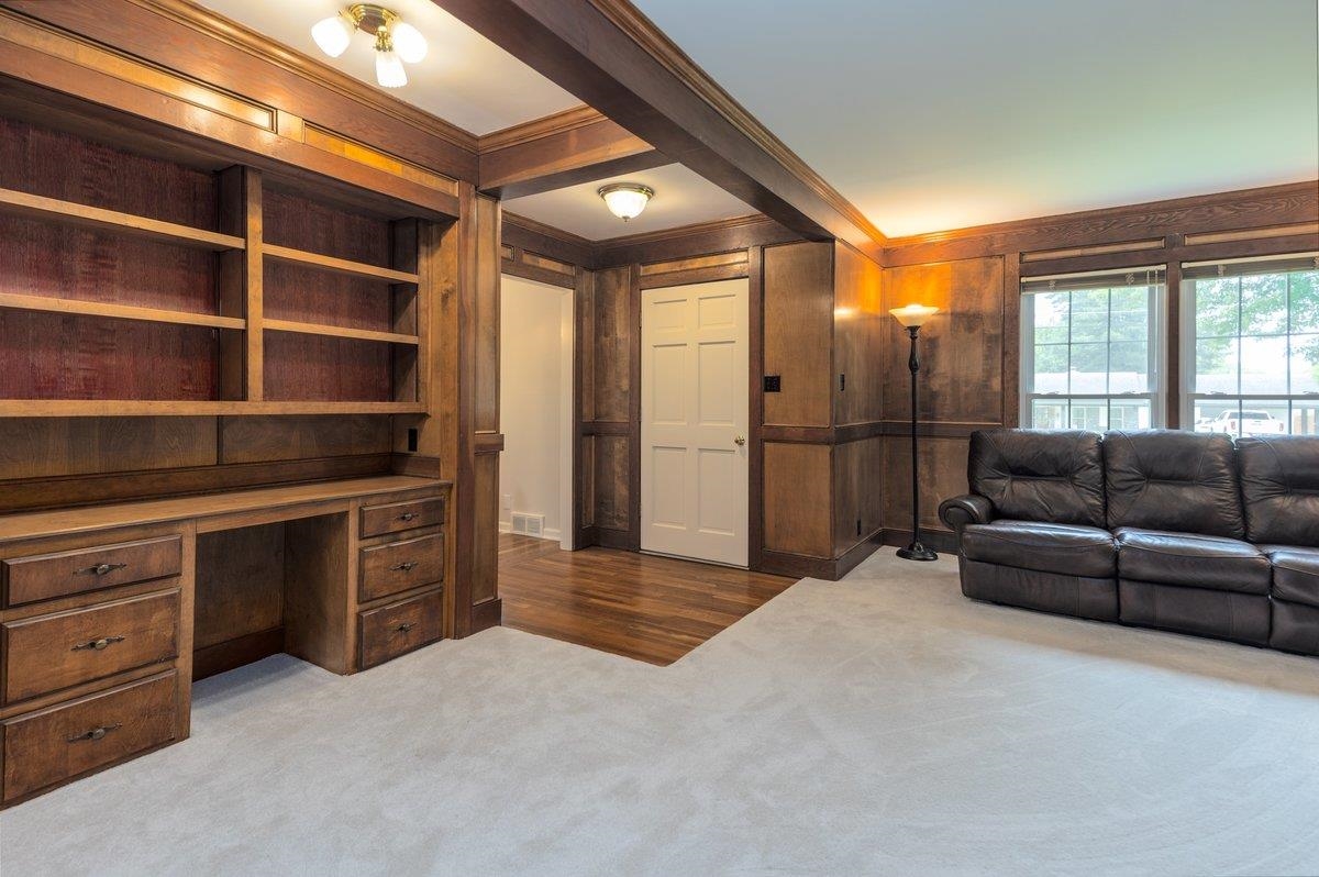 670 Peterson Lake Road Collierville, TN 38017 - Photo 14 of 37 Built-in wood cabinetry with integrated desk and shelving, complemented by wood paneling and trim