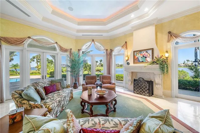 a bathroom with a granite countertop sink a toilet a mirror and shower
