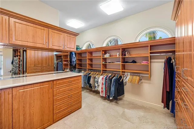a view of a house with large tub and wooden fence