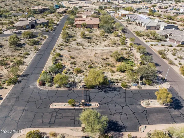 an aerial view of residential building and parking space