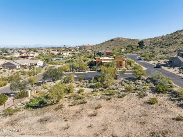 an aerial view of residential building and parking space