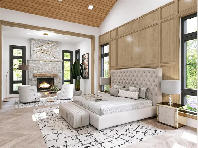 a spacious bedroom with a large bed and a fireplace