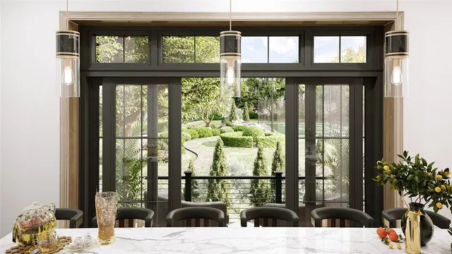 a view of a balcony and dining room with a large window