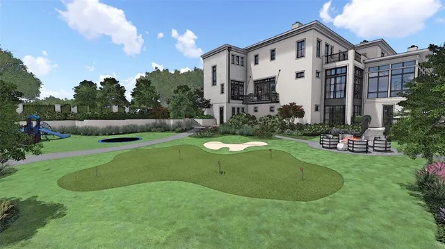 a view of a white house with a big yard and potted plants