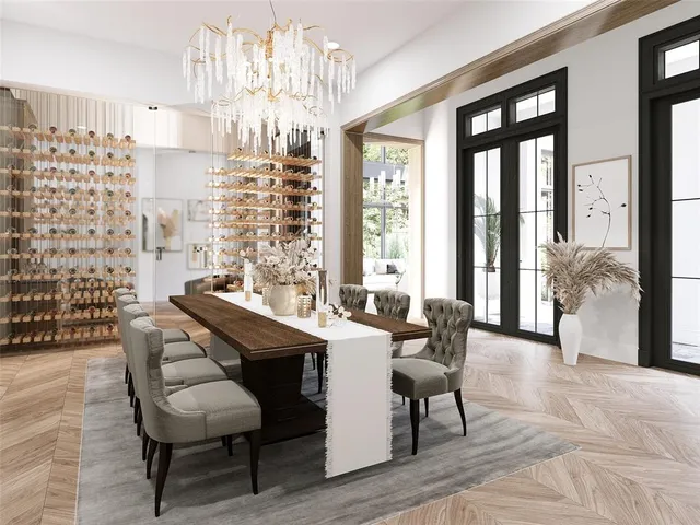 a view of a dining room with furniture and chandelier
