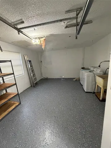 a view of an empty room with windows