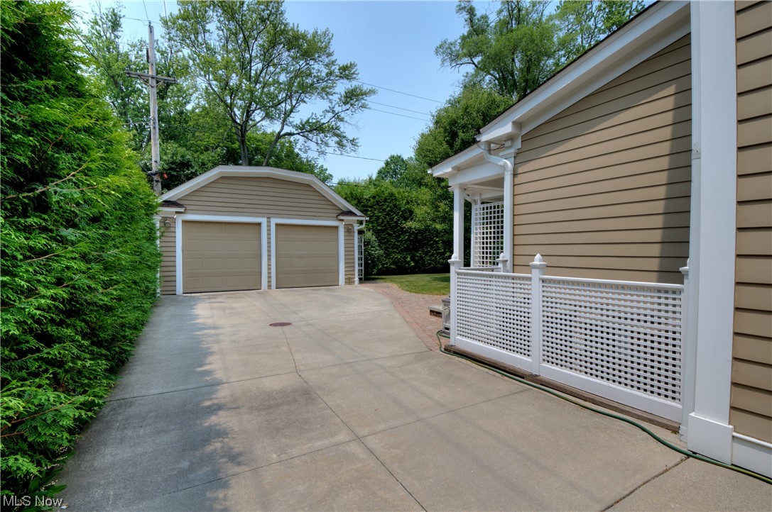 2878 Brighton Road Cleveland, OH 44120 - Photo 35 of 35 Enjoy views of the beautifully landscaped yard and gardens from the fabulous sandstone portico in front, covered terrace and large composite deck
in back