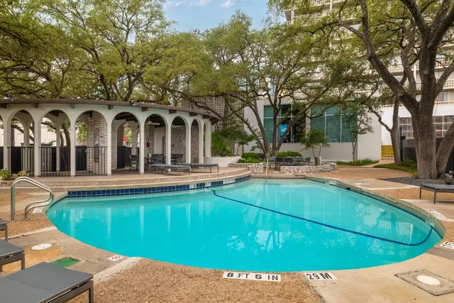 a view of a swimming pool with a patio