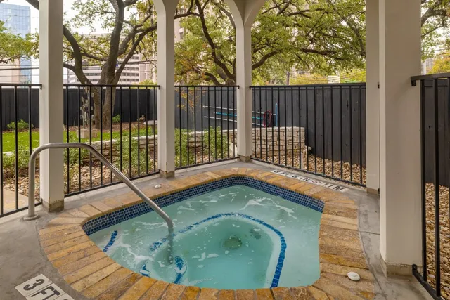 a view of swimming pool with a patio and backyard