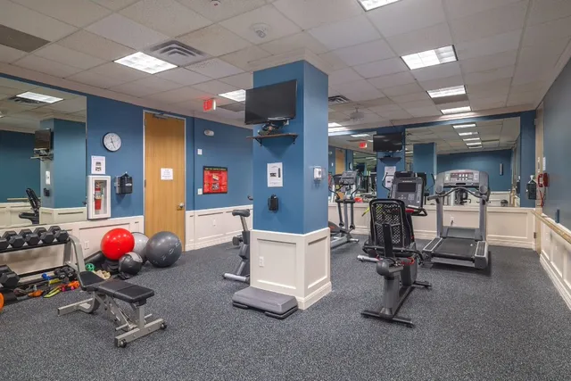 a room with gym equipment and equipment