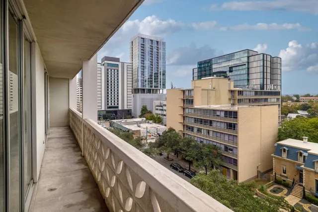 a view of balcony with furniture